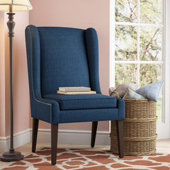 Wingback Chair Adds Stately Style To Any Living Room or Den Four Tapered Legs and Features Neutral-Hued Polyester